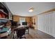 Home office with built-in shelving, desk, and guitar wall mounts at 8204 Constance Dr, Sarasota, FL 34243