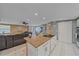 Open concept kitchen features a granite island and stainless steel appliances at 8204 Constance Dr, Sarasota, FL 34243