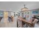 Bright kitchen with a farmhouse style table and stainless steel appliances at 8204 Constance Dr, Sarasota, FL 34243