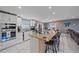 Spacious kitchen with granite island, stainless steel appliances, and white cabinets at 8204 Constance Dr, Sarasota, FL 34243