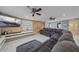 Spacious living room with sectional sofa and large TV at 8204 Constance Dr, Sarasota, FL 34243