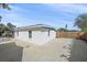 Side yard with concrete parking and wooden gate at 8204 Constance Dr, Sarasota, FL 34243