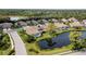 Community overview showcasing lakefront villas with pools at 8737 Pebble Creek Ln, Sarasota, FL 34238