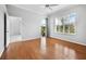 Spacious bedroom with hardwood floors and access to balcony at 8737 Pebble Creek Ln, Sarasota, FL 34238