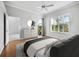 Bright bedroom with hardwood floors, plantation shutters and access to balcony at 8737 Pebble Creek Ln, Sarasota, FL 34238