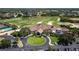 Community clubhouse with surrounding golf course at 8737 Pebble Creek Ln, Sarasota, FL 34238