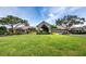 Luxury clubhouse exterior with lush landscaping at 8737 Pebble Creek Ln, Sarasota, FL 34238