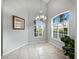 Spacious dining area with large windows and elegant chandelier at 8737 Pebble Creek Ln, Sarasota, FL 34238