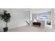 Spacious loft area with a built-in desk and window seat at 8737 Pebble Creek Ln, Sarasota, FL 34238
