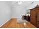 Home office with hardwood floors and built-in armoire at 8737 Pebble Creek Ln, Sarasota, FL 34238
