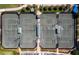 Aerial view of multiple tennis courts at 8737 Pebble Creek Ln, Sarasota, FL 34238