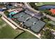 Aerial view of community tennis courts and pool at 8737 Pebble Creek Ln, Sarasota, FL 34238