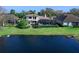 Luxury home with a pool and lush landscaping at 9420 Old Hyde Park Pl, Lakewood Ranch, FL 34202