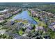 Aerial view of house location near lake in upscale neighborhood at 9420 Old Hyde Park Pl, Lakewood Ranch, FL 34202