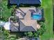 Bird's eye view of a home with pool and lush landscaping at 9420 Old Hyde Park Pl, Lakewood Ranch, FL 34202