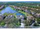 Aerial view of house and neighborhood; desirable location, lake view at 9420 Old Hyde Park Pl, Lakewood Ranch, FL 34202