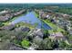 Aerial view of lakefront home in established neighborhood at 9420 Old Hyde Park Pl, Lakewood Ranch, FL 34202