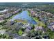 Aerial view showing home's location in a community by a lake at 9420 Old Hyde Park Pl, Lakewood Ranch, FL 34202