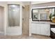 Bathroom with a large walk-in shower and granite vanity at 9420 Old Hyde Park Pl, Lakewood Ranch, FL 34202