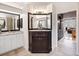 Bathroom with a corner vanity and double sinks at 9420 Old Hyde Park Pl, Lakewood Ranch, FL 34202