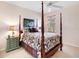 Charming bedroom with a post bed and tasteful decor at 9420 Old Hyde Park Pl, Lakewood Ranch, FL 34202