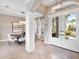 Elegant entryway with high ceilings, chandelier, and view to backyard at 9420 Old Hyde Park Pl, Lakewood Ranch, FL 34202