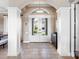 Bright and spacious foyer with double doors and tile flooring at 9420 Old Hyde Park Pl, Lakewood Ranch, FL 34202