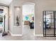 Open hallway leading to kitchen and living areas at 9420 Old Hyde Park Pl, Lakewood Ranch, FL 34202