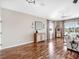 Bright living room with hardwood floors and large windows offering water views at 9420 Old Hyde Park Pl, Lakewood Ranch, FL 34202