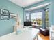 Home office with large windows, hardwood floors, and a glass-top desk at 9420 Old Hyde Park Pl, Lakewood Ranch, FL 34202