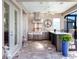 Stainless steel appliances and a large island feature in this outdoor kitchen at 9420 Old Hyde Park Pl, Lakewood Ranch, FL 34202