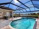 Enjoy this refreshing pool and spa with a covered patio and outdoor kitchen at 9420 Old Hyde Park Pl, Lakewood Ranch, FL 34202