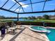 Relaxing pool and spa with lounge chairs and a screened enclosure at 9420 Old Hyde Park Pl, Lakewood Ranch, FL 34202