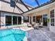 Inviting pool area with covered patio and seating at 9420 Old Hyde Park Pl, Lakewood Ranch, FL 34202