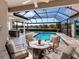 Relaxing pool and patio area with seating for entertaining at 9420 Old Hyde Park Pl, Lakewood Ranch, FL 34202