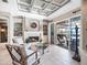Cozy sitting room features a fireplace and sliding doors to patio at 9420 Old Hyde Park Pl, Lakewood Ranch, FL 34202