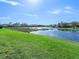 Scenic waterfront view with lush green landscaping at 9420 Old Hyde Park Pl, Lakewood Ranch, FL 34202