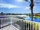 Stunning balcony view overlooking a peaceful canal and lush landscape at 9420 Old Hyde Park Pl, Lakewood Ranch, FL 34202