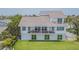 Modern home with large deck and backyard overlooking the water at 970 Boca Ciega Isle Dr, St Pete Beach, FL 33706