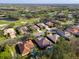 Aerial view of upscale community with golf course and waterfront homes at 9818 Discovery Ter, Bradenton, FL 34212