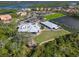 Aerial view of the Waterlefe Golf & River Club clubhouse and adjacent golf course at 9818 Discovery Ter, Bradenton, FL 34212