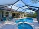 Lush landscaping surrounds this relaxing pool and spa area at 9818 Discovery Ter, Bradenton, FL 34212