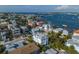 Aerial view of waterfront home showcasing a modern design and metal roof in a residential area at 105 6Th S St, Bradenton Beach, FL 34217