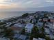 Aerial view of beachside home with ocean and neighborhood views at 105 6Th S St, Bradenton Beach, FL 34217