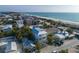 Aerial view of beach house community, showcasing a modern two-story home with a private pool at 105 6Th S St, Bradenton Beach, FL 34217