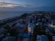 Beachfront home aerial view at dusk, showing home and beach at 105 6Th S St, Bradenton Beach, FL 34217