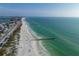 Aerial view of beach with waves and pier at 105 6Th S St, Bradenton Beach, FL 34217