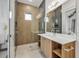 Modern bathroom with geometric tile and floating vanity at 105 6Th S St, Bradenton Beach, FL 34217