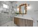 Spa-like bathroom with a walk-in shower and a unique mirror at 105 6Th S St, Bradenton Beach, FL 34217