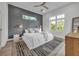 Stylish bedroom with a textured wall and ceiling fan at 105 6Th S St, Bradenton Beach, FL 34217
